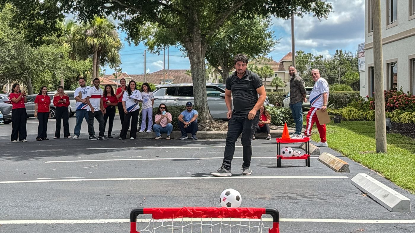 Students playing soccer outside during a school activity at Antares Fort Myers.
