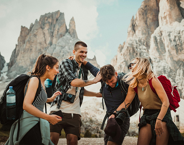 Decorative image of students enjoy themselves, laughing together, and preparing to go hiking.